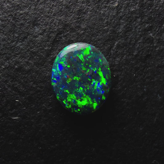 0.76ct Black Opal, This Gem Has Speckled mossy Pattern With A Green, Blue Color Play