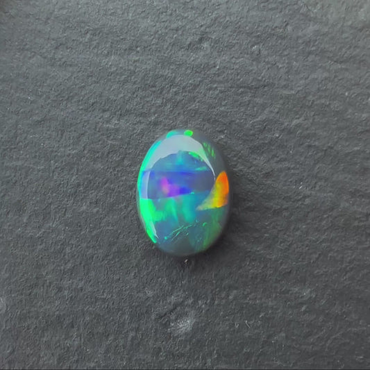 0.70 Crystal Opal With A Green, Yellow, Gold Play Of Color, From Lightning Ridge Australia (Copy)