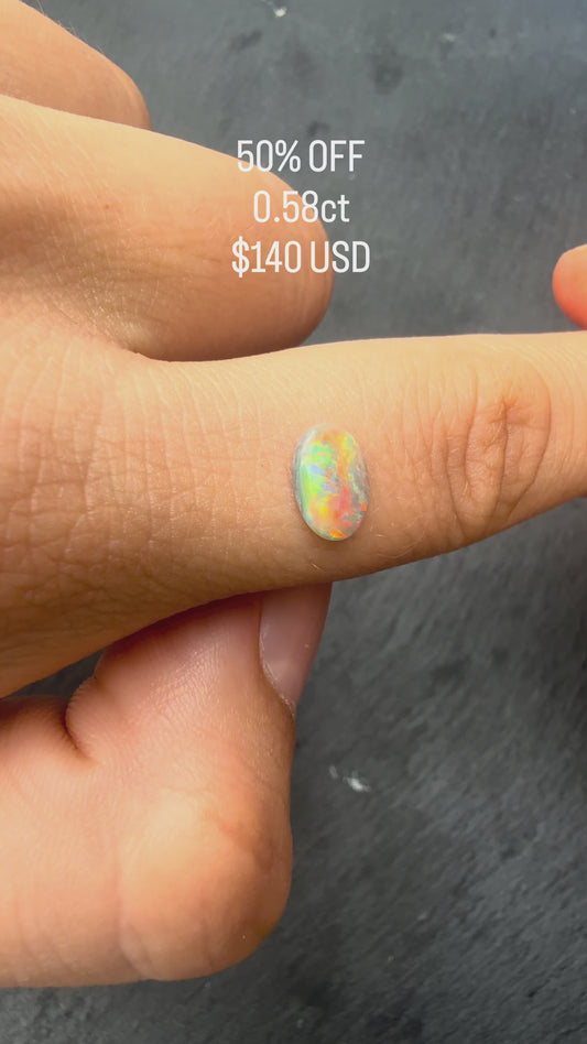 0.58ct Black Opal With A Red, Pink Multicolor Play Of Color, From Lightning Ridge Australia