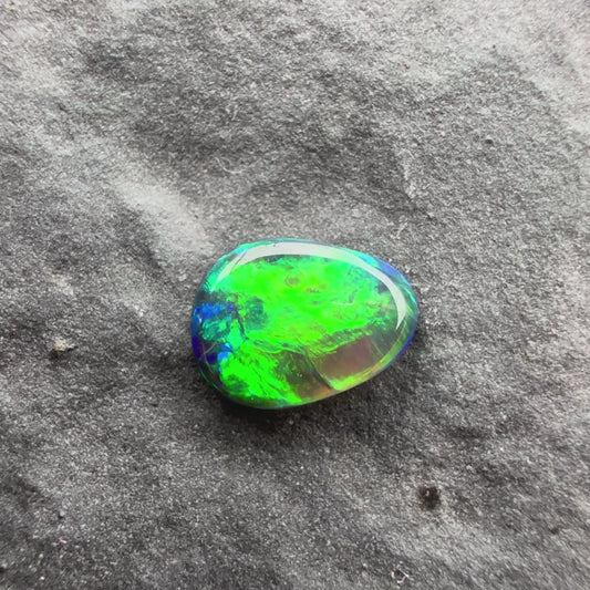 0.24cts Top Gem Micro Black Opal With A Green, Gold Broadflash Pattern Pattern