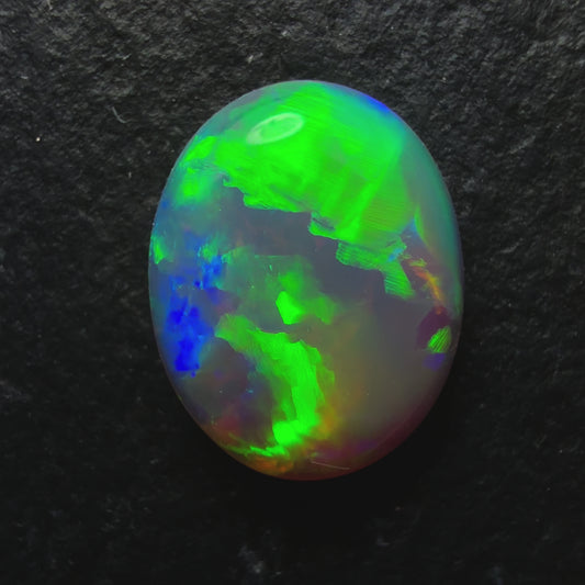 0.93ct Drak Crystal Opal, This stone Has A Vivid Green Broadflash Pattern With Hints Of Blue