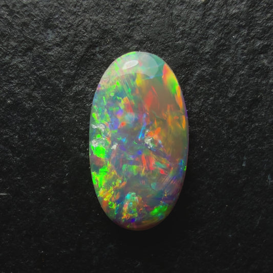 0.83ct Dark Crystal Opal With Lovely Multicolor Palette And Lots Of Depth