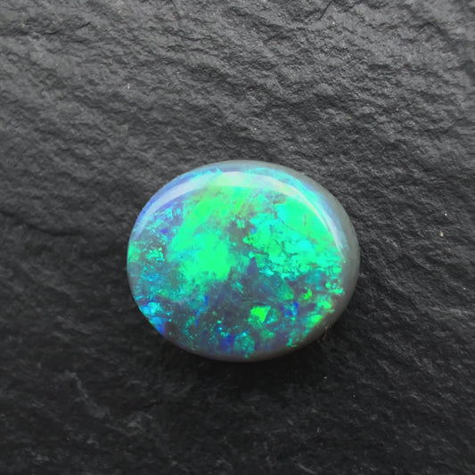 1.6ct Gem Black opal with a unique pattern and minty green color palette