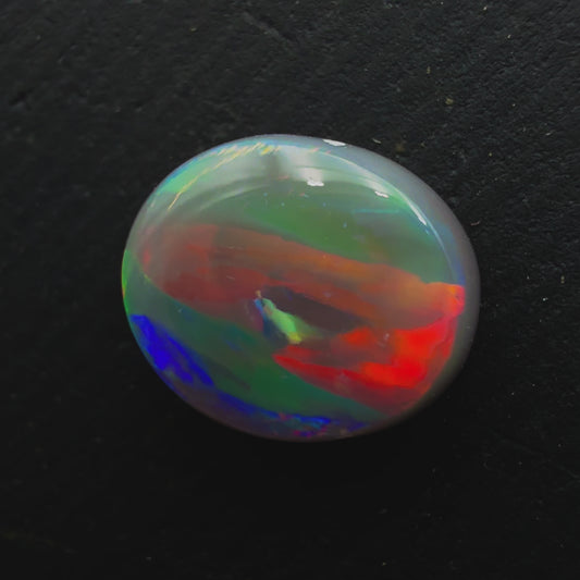 1.66ct Dark Opal With A Red-Multicolor Palette And a Very Rare Ribbon Pattern