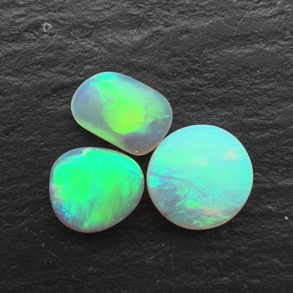 1.1ct Bundle (Price For Parcel) Matte finished opals with a soft purple-green glow