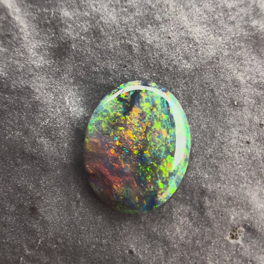 0.64cts Black Opal With A Red Multicolor Play Of Color, From Lightning Ridge Australia