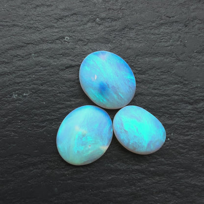 2.2ct Bundle (Price For Parcel) Matte finished opals with a soft purple-green glow