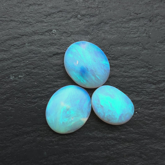 2.2ct Bundle (Price For Parcel) Matte finished opals with a soft purple-green glow