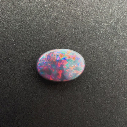 0.58cts Dark Opal With A Red Pink Multicolor Play Of Color, From Lightning Ridge Australia
