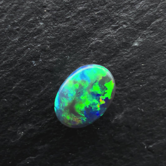 0.5cts Gem Black Opal With A Blocky Deep Green Blue Gold Pattern