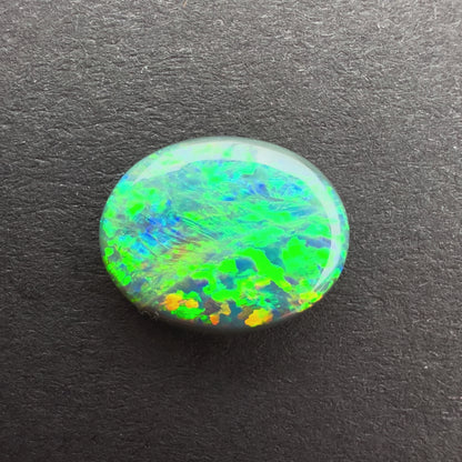 1.63cts Black Opal With A Green, Yellow, Gold Play Of Color, From Lightning Ridge Australia