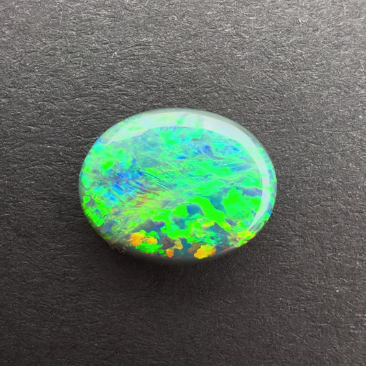 1.63cts Black Opal With A Green, Yellow, Gold Play Of Color, From Lightning Ridge Australia