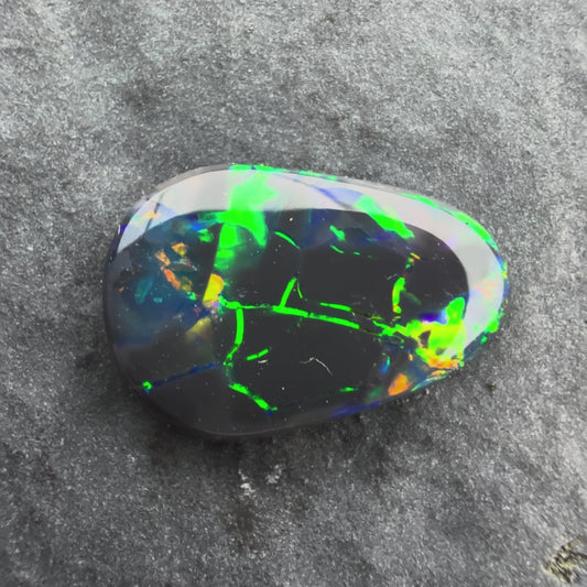 1.25cts Affordable Black Opal With A Green Yellow Gold Play Of Color, From Lightning Ridge Australia