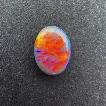 0.66cts Black Opal With A Red Pink Multicolor Play Of Color, From Lightning Ridge Australia