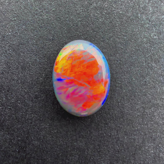 0.66cts Black Opal With A Red Pink Multicolor Play Of Color, From Lightning Ridge Australia