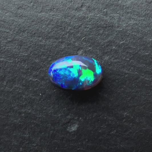 0.58cts Black and Crystal Opal With A Dark Blue, Green Play Of Color, From Lightning Ridge Australia