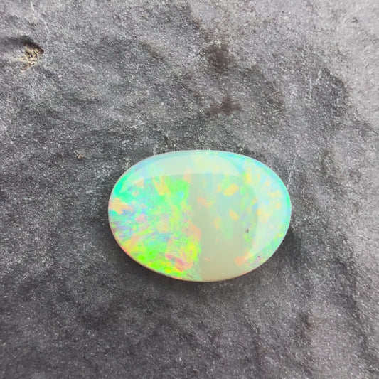 0.6cts Affordable Crystal Opal With A Green Yellow Gold Play Of Color, From Lightning Ridge Australia