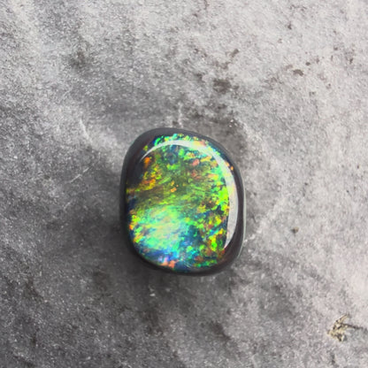 0.66cts Affordable Black Opal With A Vivid Red Pink Multicolor Play Of Color, From Lightning Ridge Australia