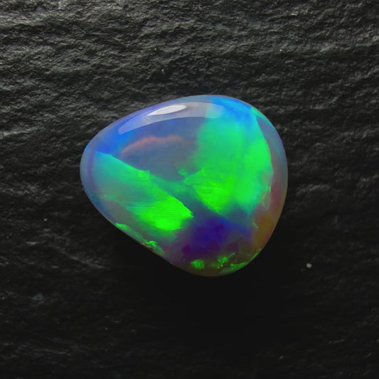 1.29ct black Opal, This Gem Has A Bright Green Blue Color Pallet With Rays Of Color Rolling Across The Stone