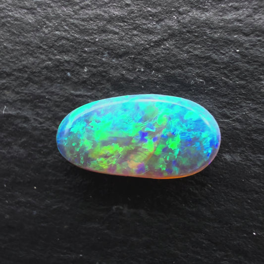 0.95cts Gem Crystal Opal With A Mixed Deep Green Blue Gold Pattern