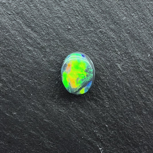 0.58cts Black Opal with a Green Yellow Gold Play of Color, From Lightning Ridge Australia