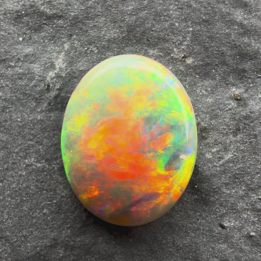 0.69cts Gem Dark Opal With Red Pink Multicolor Pattern