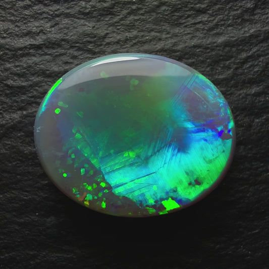 2.44ct Dark Opal, This Gem Has An Unusual Mix Of Patterns And A Pastel Blues And Green Color Palette