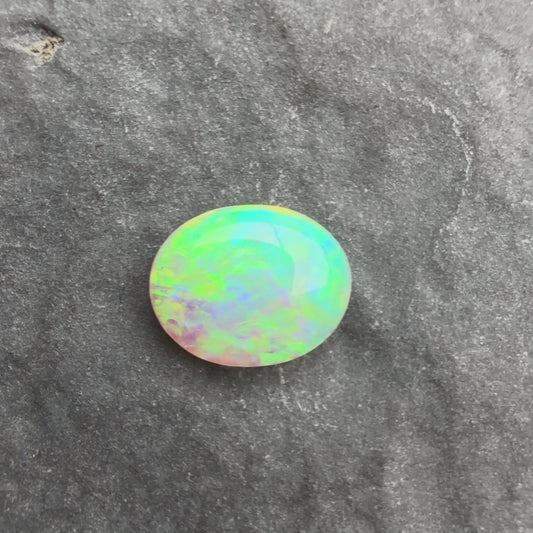 0.5cts Crystal Opal With A Green, Yellow, Gold Play Of Color, From Lightning Ridge Australia