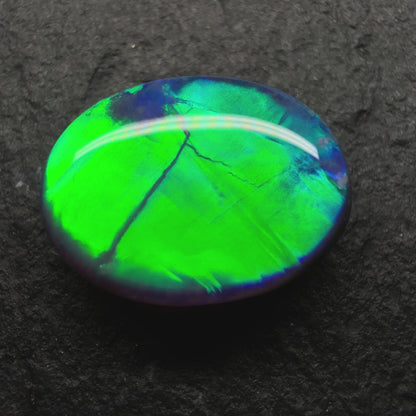 1.95ct World Class Black Opal. This Stone Has Blinding Green-Gold color Palette, With A Rolling Broadflash Pattern