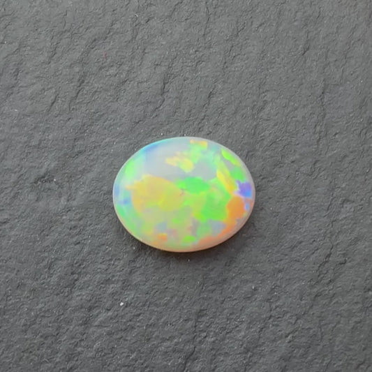 0.70ct Crystal Opal With A Green, Yellow, Gold Play Of Color, From Lightning Ridge Australia