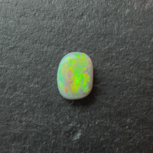 0.49 Dark Opal With A Green, Yellow, Gold Play Of Color, From Lightning Ridge Australia