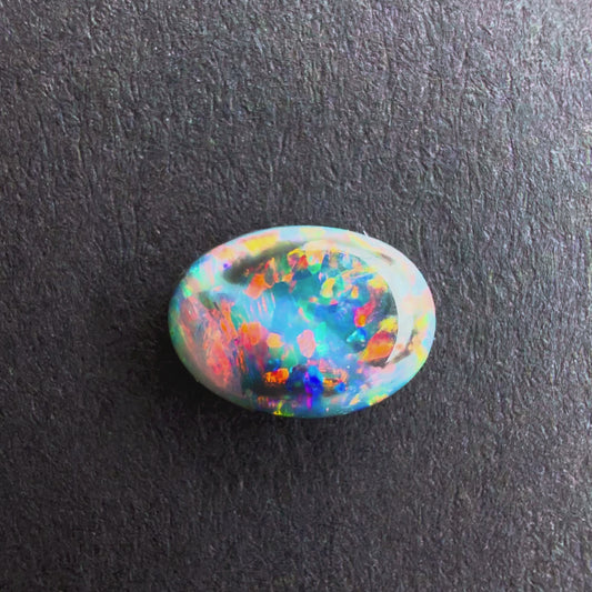0.75cts Black Opal With A Red Pink Multicolor Play Of Color, From Lightning Ridge Australia