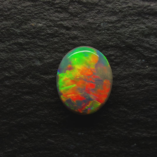 0.72ct Dark Opal With A Brilliant Green-Orange Broadflash Pattern