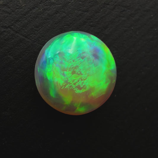 1.1ct Dark Crystal Opal With A Vivid Green Gold Color Palette And Lots Of Depth