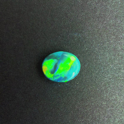 0.64cts Black Opal With A Green, Yellow, Gold Play Of Color, From Lightning Ridge Australia