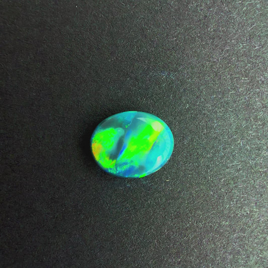 0.64cts Black Opal With A Green, Yellow, Gold Play Of Color, From Lightning Ridge Australia