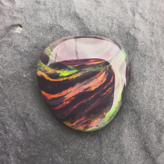 2.23cts Picture stone Black Opal With A Red Pink Multicolor Palette