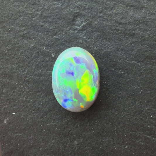 0.95ct Crystal Opal With A Green, Yellow, Gold Play Of Color, From Lightning Ridge Australia