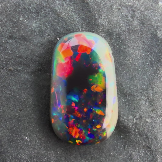 0.8cts Gem Black Opal With A Red Pink Multicolor Play Of Color