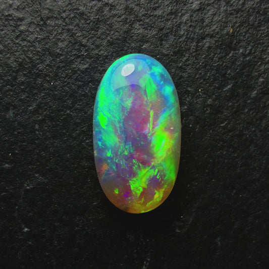 1.0ct Drak Crystal Opal. This stone Has A Rich Green-Gold Color Palette Undertones Of Blue And Lots Of Depth