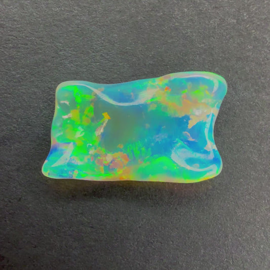 2.06cts Crystal Opal Carving With A Red Pink Multicolor Play Of Color, From Lightning Ridge Australia