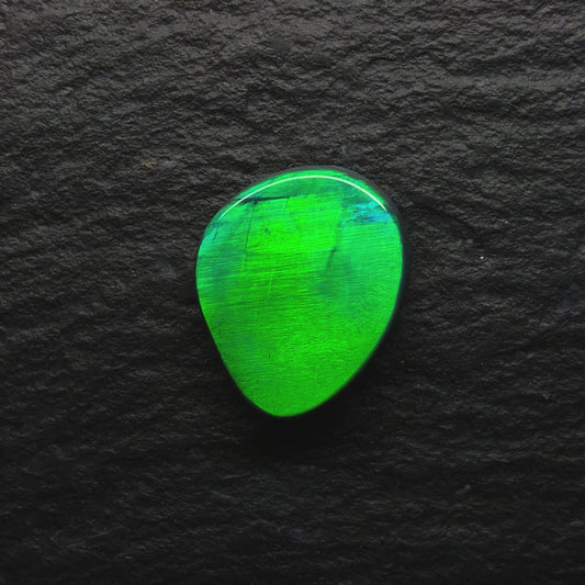 1.28 World Class Black Opal With A Blindingly Bright Metallic Green Rolling Broadflash Pattern