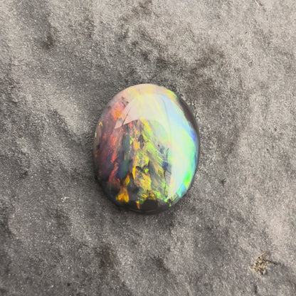 0.59cts Affordable Black Opal With A Vivid Red Pink Multicolor Play Of Color, From Lightning Ridge Australia