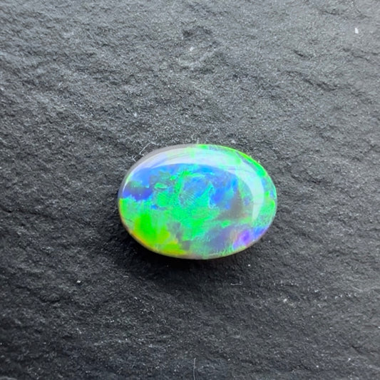 0.56cts Black Opal With A Green Blue Play Of Color, From Lightning Ridge Australia