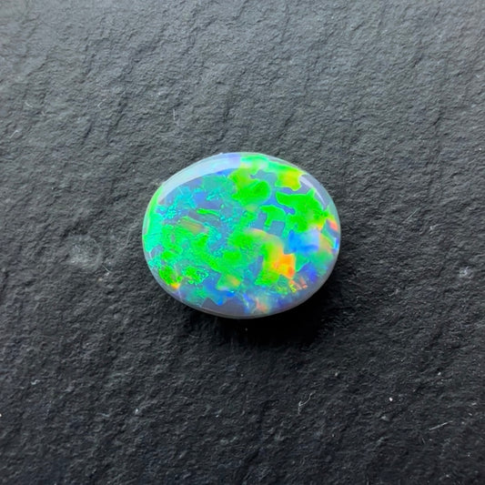 0.72cts Black Opal With A Green, Yellow Gold Play Of Color, From Lightning Ridge Australia