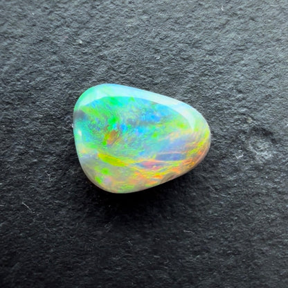 0.60cts Black Opal With A Red Pink Multicolor Play Of Color, From Lightning Ridge Australia