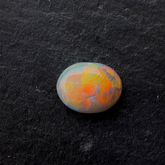 0.72ct Crystal Opal With A Red, Pink Multicolor Play Of Color, From Lightning Ridge Australia