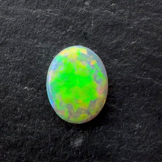 0.95ct Crystal Opal With A Green, Yellow, Gold Play Of Color, From Lightning Ridge Australia