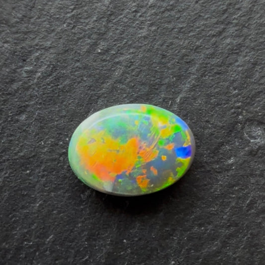 1.10ct Black Opal With A Green, Yellow, Gold Play Of Color, From Lightning Ridge Australia