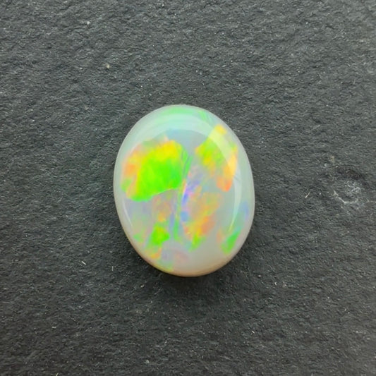 O.86ct Opal With Green, Yellow, Gold Play Of Color, From Lightning Ridge Australia